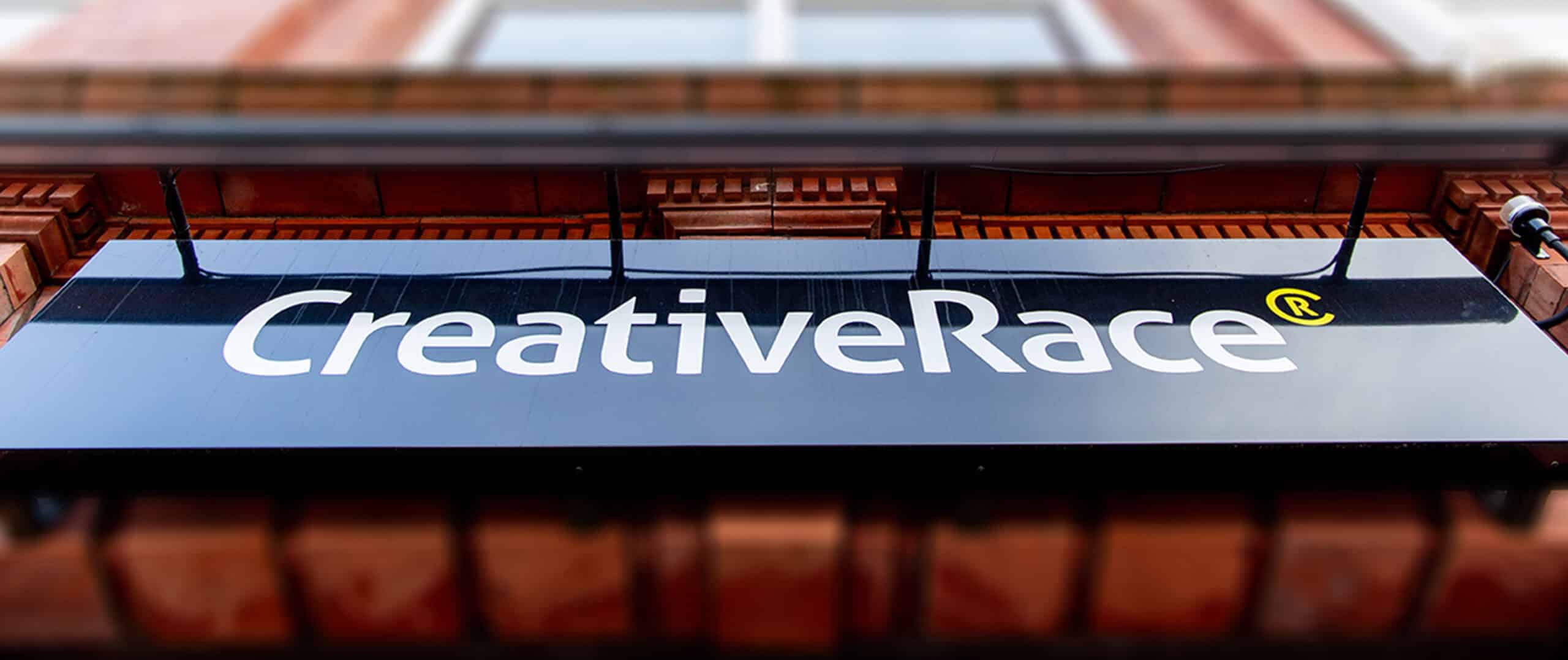 Creativerace sign on office building exterior